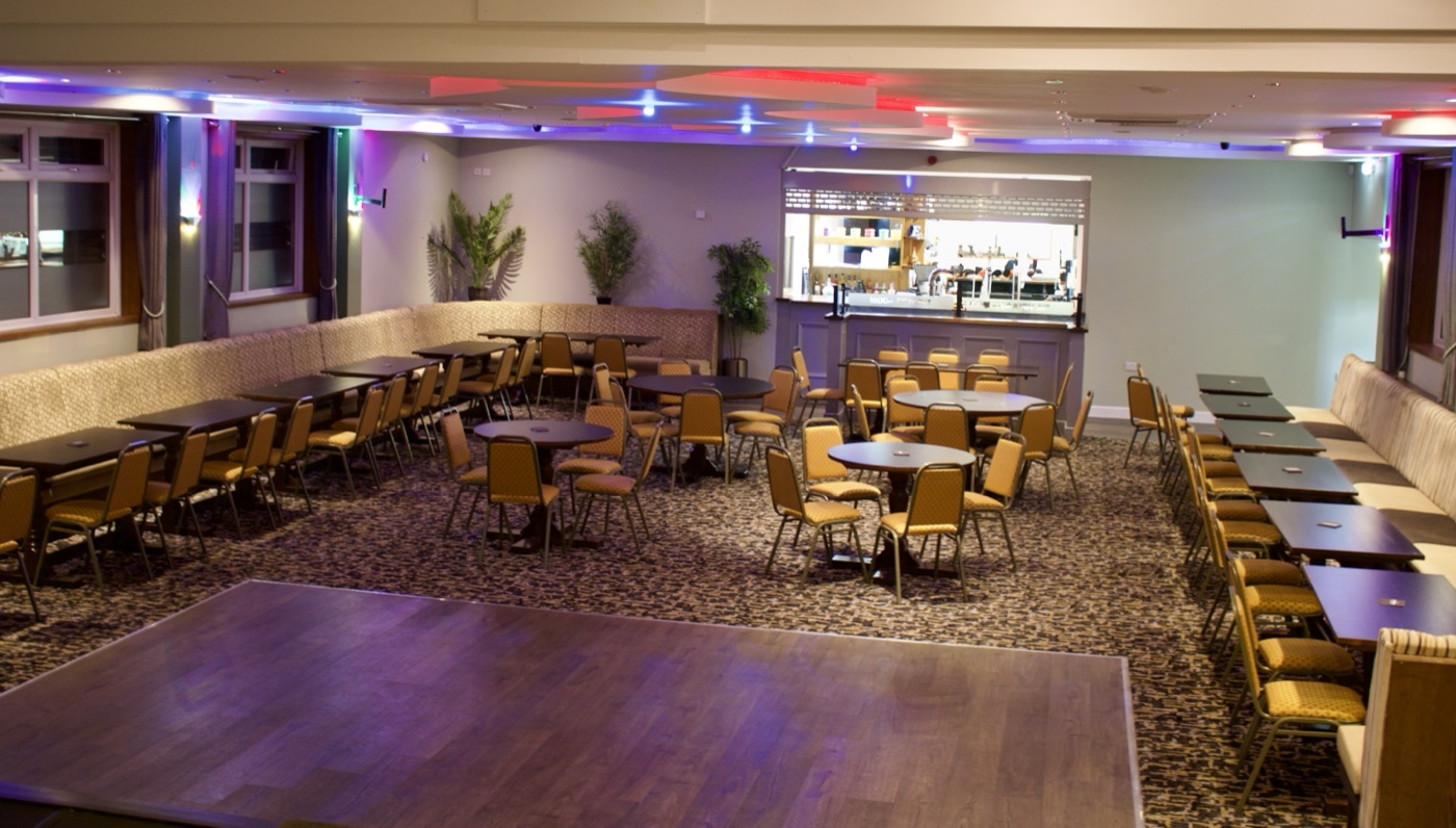 The Viper Room Function Suite with wooden parquet dance floor and banquet seating